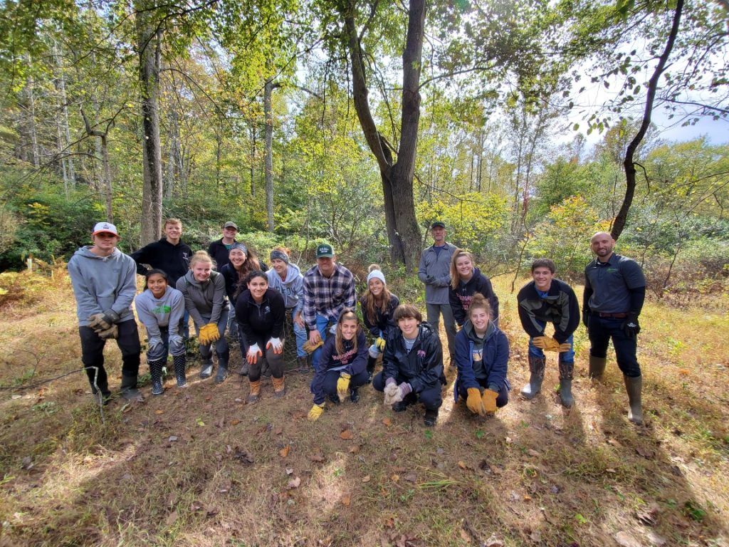 Madison High School students contribute to Preserve stream restoration efforts through native tree plantings